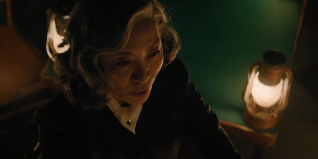 A Haunting in Venice Clip Shows Michelle Yeoh Calling Upon a Spirit